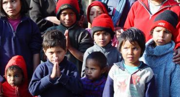 Volunteer Teacher with School Children in Nepal.